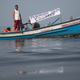 Fishermen protest contamination in Guanabara Bay on July 3; “Pescador pede socorro” means “fishermen ask for help.” Image via AP.